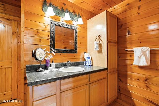 1130 Sharp Rd, Sevierville, TN 37876 - bathroom featuring wooden walls and vanity