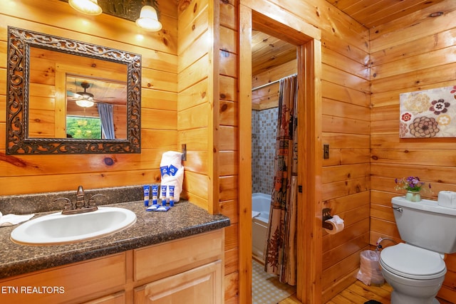 1130 Sharp Rd, Sevierville, TN 37876 - bathroom featuring vanity, wood walls, and shower / tub combo