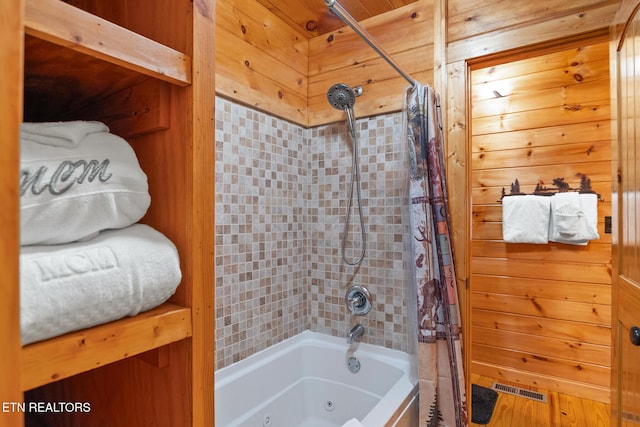 1130 Sharp Rd, Sevierville, TN 37876 - bathroom with a combined bath / shower with jetted tub and wooden walls