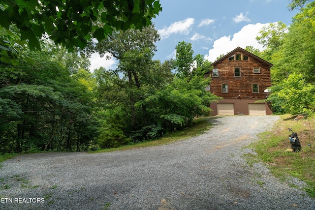 1130 Sharp Rd, Sevierville, TN 37876 - view of front of home with an attached garage and gravel driveway