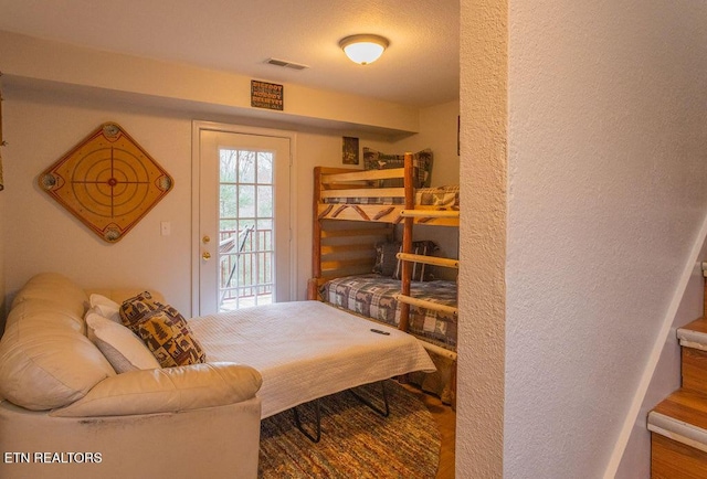 537 Johnson Ln Unit 1 & 2, Gatlinburg, TN 37738 - bedroom featuring a textured wall and access to outside