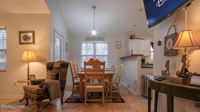 537 Johnson Ln Unit 1 & 2, Gatlinburg, TN 37738 - dining space with healthy amount of natural light, light wood-style flooring, and vaulted ceiling