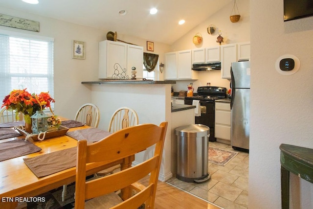537 Johnson Ln Unit 1 & 2, Gatlinburg, TN 37738 - kitchen with electric range, freestanding refrigerator, white cabinetry, dark countertops, and under cabinet range hood
