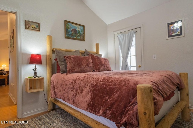 537 Johnson Ln Unit 1 & 2, Gatlinburg, TN 37738 - bedroom with vaulted ceiling and wood finished floors