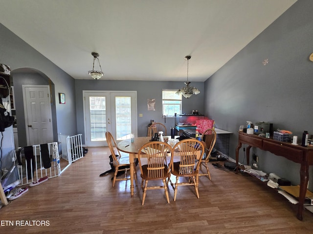 855 N Ridgecrest Rd, Luttrell, TN 37779 - dining area featuring wood finished floors, arched walkways, and lofted ceiling
