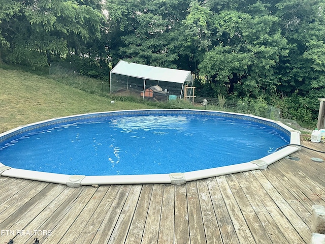 855 N Ridgecrest Rd, Luttrell, TN 37779 - swimming pool with a wooden deck, an outdoor structure, and exterior structure