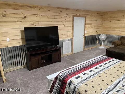 855 N Ridgecrest Rd, Luttrell, TN 37779 - bedroom featuring wood walls and carpet flooring