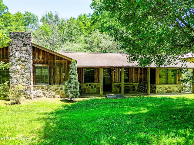 2255 Citico Rd, Vonore, TN 37885 - view of front of property featuring stone siding, a front yard, and a chimney