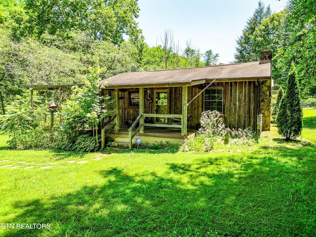 2255 Citico Rd, Vonore, TN 37885 - back of property with a chimney and a lawn