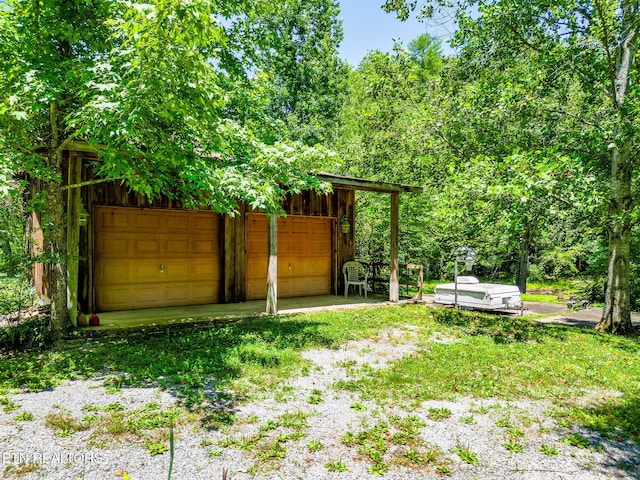 2255 Citico Rd, Vonore, TN 37885 - view of yard with a detached garage and an outdoor structure