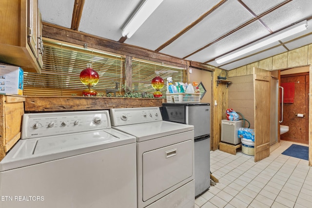 2255 Citico Rd, Vonore, TN 37885 - washroom with independent washer and dryer, light tile patterned floors, and a textured ceiling