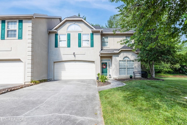 614 Chapel Point Ln, Knoxville, TN 37934 - traditional-style house featuring stucco siding, concrete driveway, a garage, and a front lawn