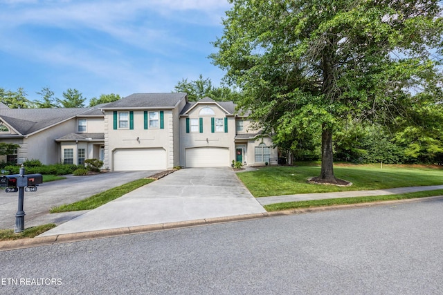 614 Chapel Point Ln, Knoxville, TN 37934 - traditional-style house with an attached garage, stucco siding, concrete driveway, and a front lawn