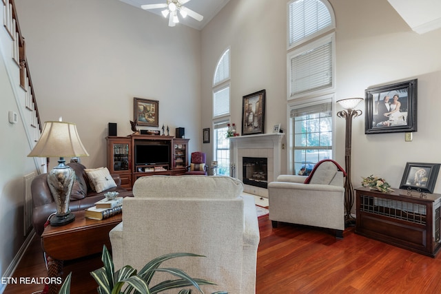 614 Chapel Point Ln, Knoxville, TN 37934 - living room with dark wood-type flooring, a tile fireplace, a ceiling fan, and a high ceiling