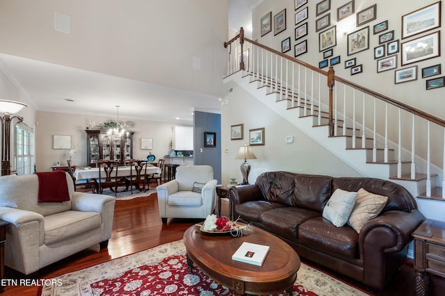 614 Chapel Point Ln, Knoxville, TN 37934 - living room with wood finished floors, a chandelier, ornamental molding, stairway, and a high ceiling