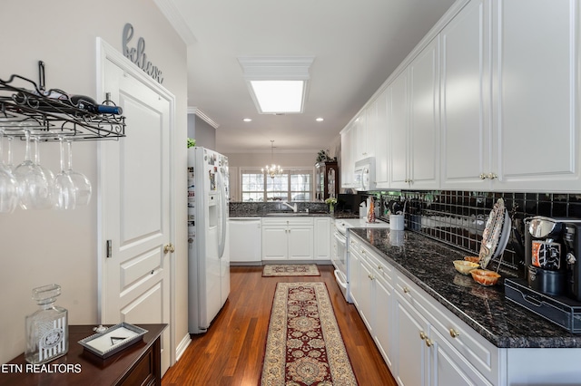 614 Chapel Point Ln, Knoxville, TN 37934 - kitchen featuring white appliances, backsplash, white cabinets, dark wood finished floors, and ornamental molding