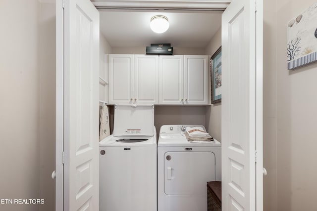 614 Chapel Point Ln, Knoxville, TN 37934 - laundry area with cabinet space and washing machine and clothes dryer