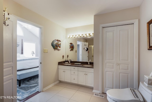 614 Chapel Point Ln, Knoxville, TN 37934 - ensuite bathroom featuring double vanity, tile patterned flooring, and a closet