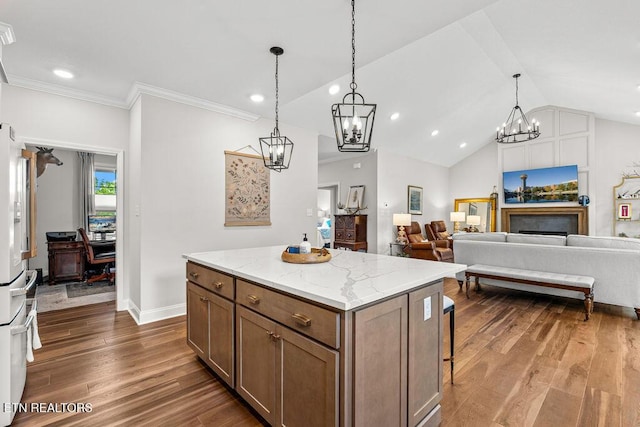 140 Walelu Trl, Vonore, TN 37885 - kitchen with a chandelier, dark wood-style floors, a kitchen island, recessed lighting, and freestanding refrigerator