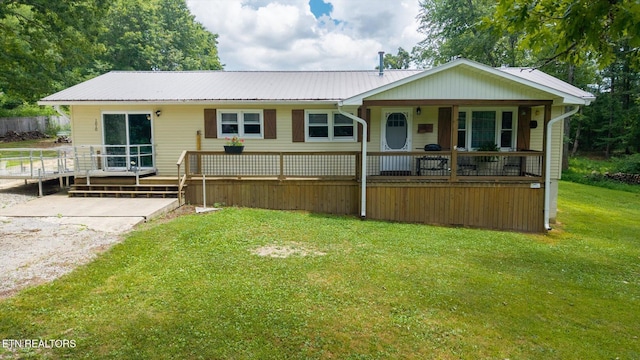1010 Smallwood Rd, Jamestown, TN 38556 - view of front of home featuring a front yard, a metal roof, and covered porch