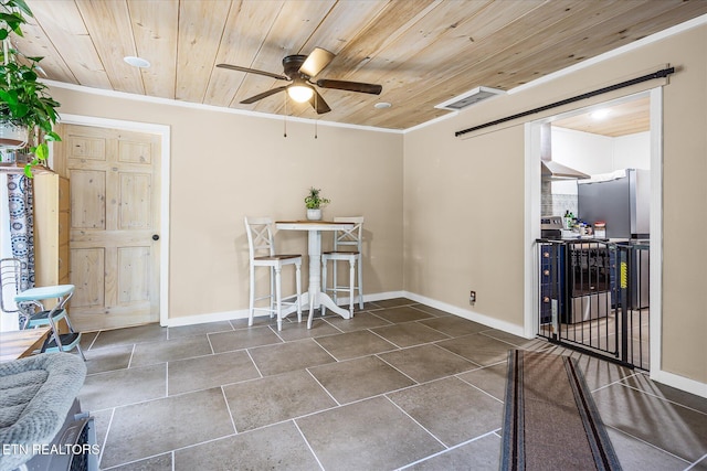 1010 Smallwood Rd, Jamestown, TN 38556 - dining space with wood ceiling, a ceiling fan, and crown molding