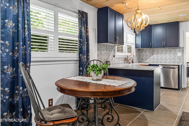 1010 Smallwood Rd, Jamestown, TN 38556 - kitchen with dishwasher, light tile patterned floors, wood ceiling, a chandelier, and tasteful backsplash