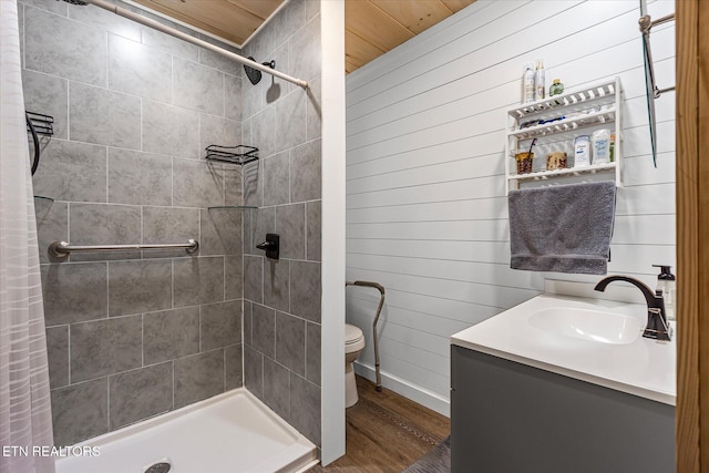 1010 Smallwood Rd, Jamestown, TN 38556 - bathroom with wood finished floors, tiled shower, vanity, and wooden walls