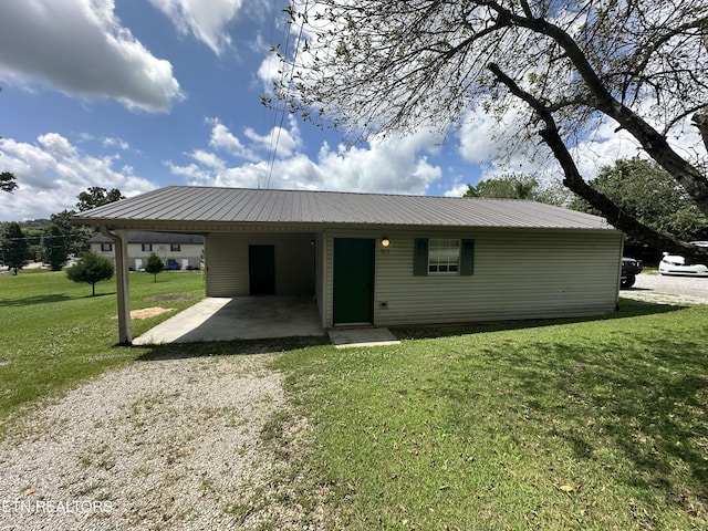 382 W Monticello Pike, Huntsville, TN 37756 - ranch-style house with an attached carport, a front lawn, driveway, and a metal roof