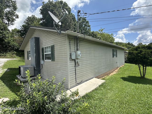 382 W Monticello Pike, Huntsville, TN 37756 - view of property exterior with a yard and a cooling unit