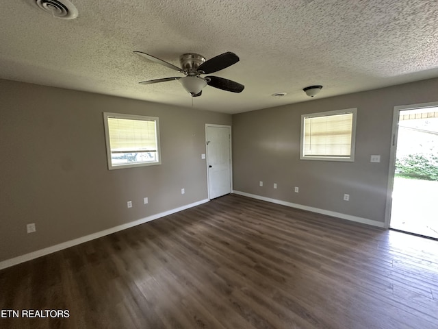 382 W Monticello Pike, Huntsville, TN 37756 - spare room with plenty of natural light, a textured ceiling, dark wood-style flooring, and ceiling fan