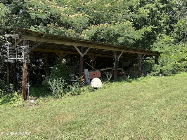 290 Bull Run Rd, Powell, TN 37849 - view of parking / parking lot featuring a forest view and a carport