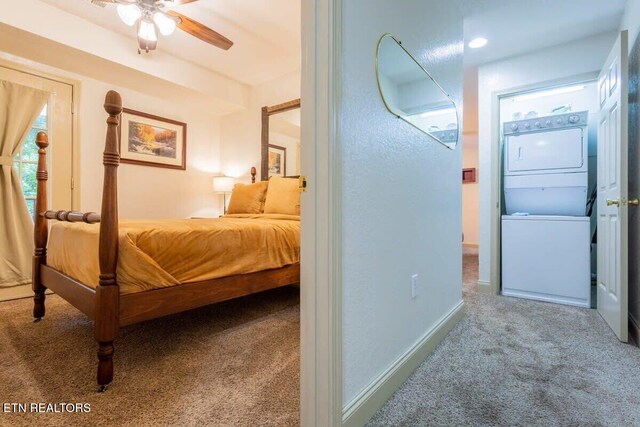 541 Johnson Ln Unit 2, Gatlinburg, TN 37738 - carpeted bedroom featuring stacked washing machine and dryer and a ceiling fan