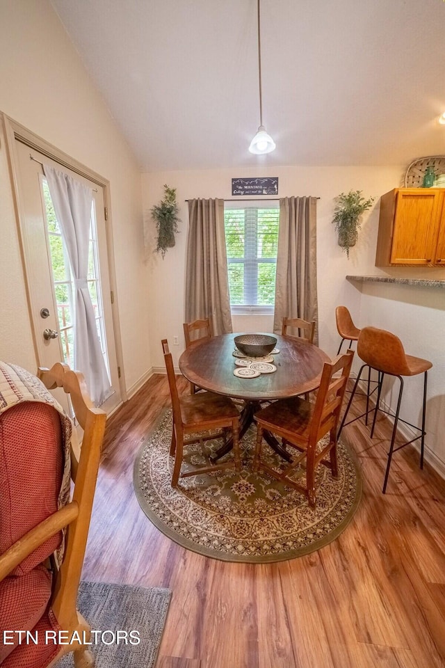 541 Johnson Ln Unit 1 & 2, Gatlinburg, TN 37738 - dining space featuring light wood finished floors and vaulted ceiling