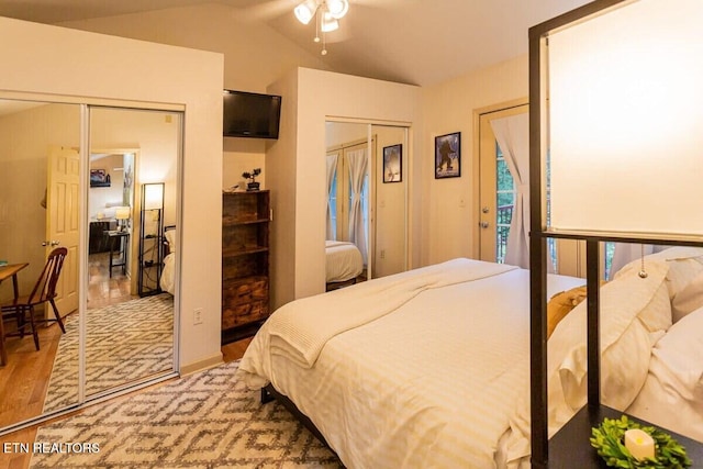 516 Proffitt Rd Unit 2, Gatlinburg, TN 37738 - bedroom featuring wood finished floors, multiple closets, vaulted ceiling, and access to exterior