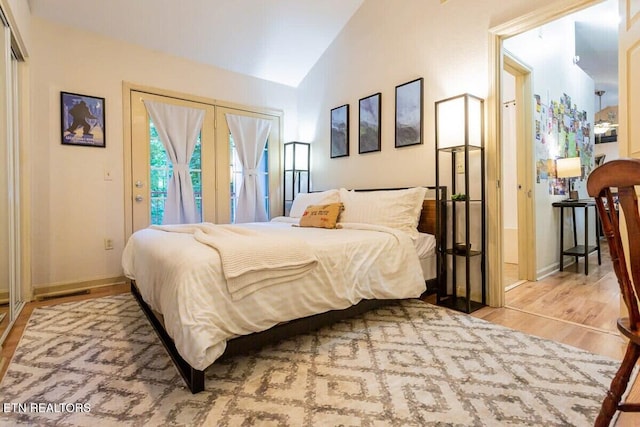 516 Proffitt Rd Unit 2, Gatlinburg, TN 37738 - bedroom featuring wood finished floors, vaulted ceiling, and access to exterior