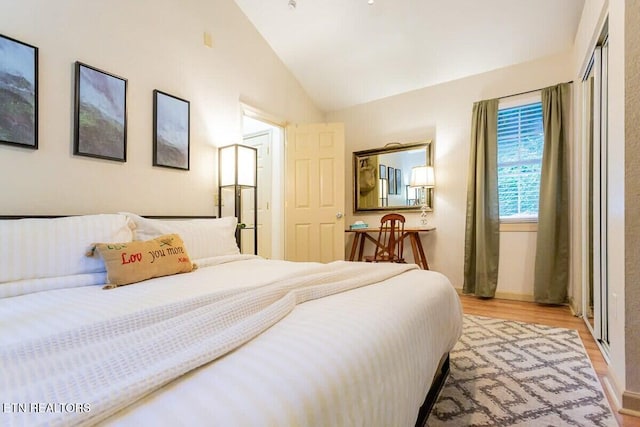 516 Proffitt Rd Unit 2, Gatlinburg, TN 37738 - bedroom with lofted ceiling and light wood finished floors