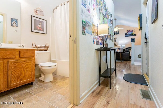 516 Proffitt Rd Unit 2, Gatlinburg, TN 37738 - full bath featuring vanity, shower / tub combo, lofted ceiling, wood finished floors, and a ceiling fan
