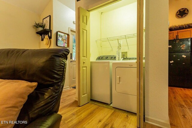 516 Proffitt Rd Unit 2, Gatlinburg, TN 37738 - laundry room with washer and clothes dryer and light wood-style floors