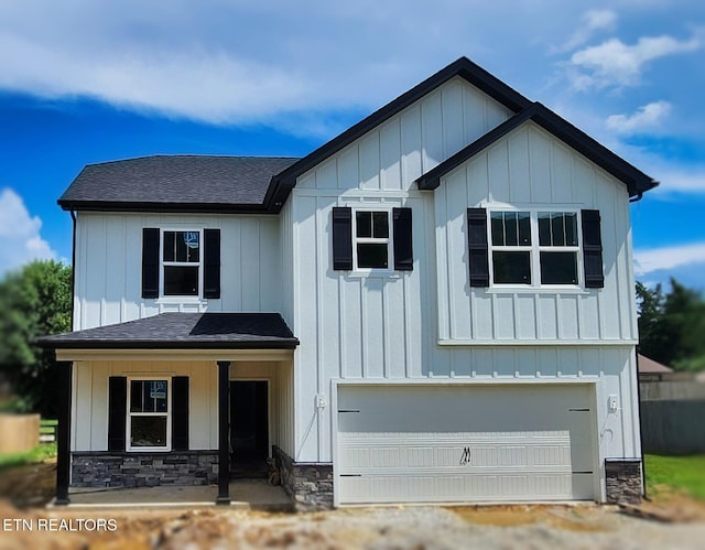 124 Chelsea Ln, Lafollette, TN 37766 - view of front of home with an attached garage, stone siding, and board and batten siding