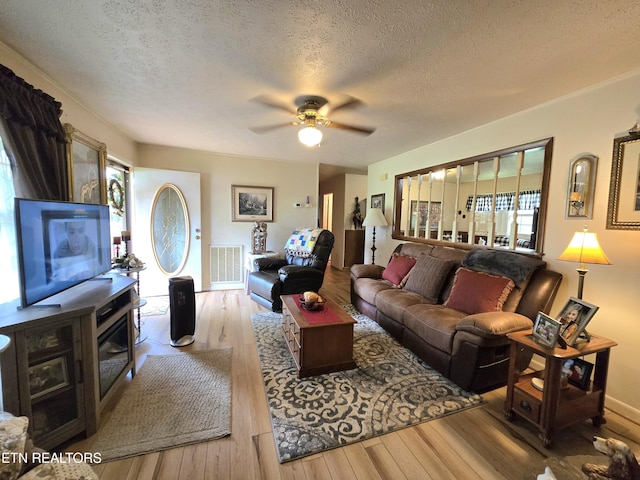 340 Machine Branch Rd, Ewing, VA 24248 - living area with wood-type flooring, plenty of natural light, a textured ceiling, and ceiling fan