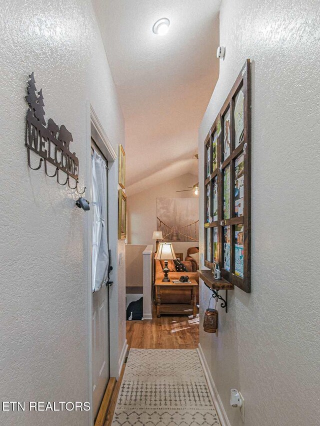 516 Proffitt Rd Unit 1 & 2, Gatlinburg, TN 37738 - hallway with wood finished floors, a textured wall, and lofted ceiling