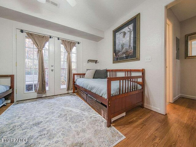 516 Proffitt Rd Unit 1 & 2, Gatlinburg, TN 37738 - bedroom featuring access to outside, french doors, and wood finished floors