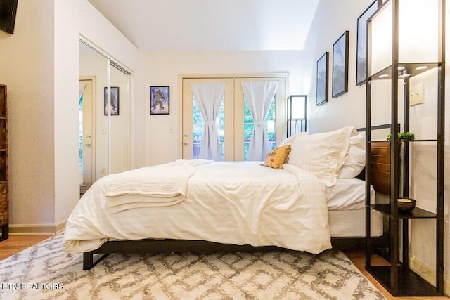516 Proffitt Rd Unit 1 & 2, Gatlinburg, TN 37738 - bedroom featuring wood finished floors, access to outside, vaulted ceiling, and a closet
