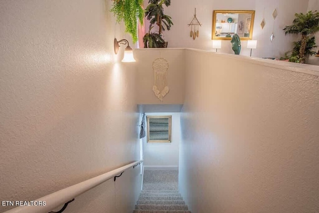 520 Proffitt Rd Unit 1, Gatlinburg, TN 37738 - staircase featuring a textured wall and carpet floors