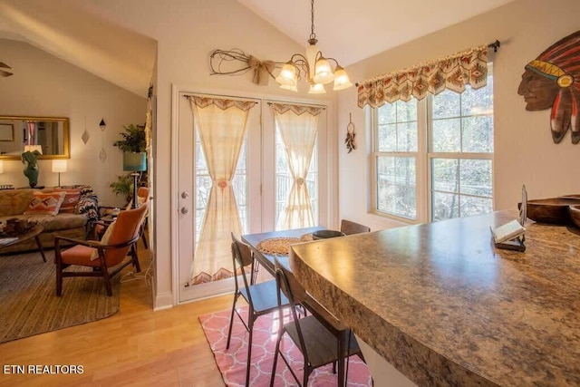 520 Proffitt Rd Unit 1, Gatlinburg, TN 37738 - dining space featuring vaulted ceiling, a chandelier, and light wood-style floors