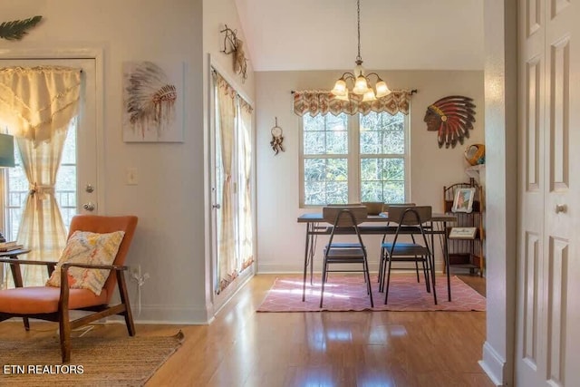 520 Proffitt Rd Unit 1, Gatlinburg, TN 37738 - dining area featuring light wood-style floors, a chandelier, and vaulted ceiling