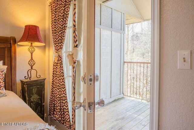 520 Proffitt Rd Unit 1, Gatlinburg, TN 37738 - doorway to outside with a textured wall and wood finished floors