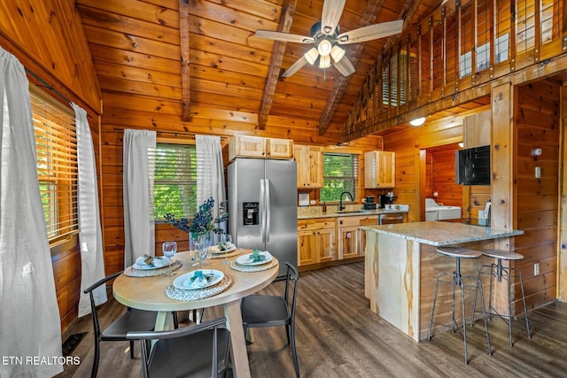 4372 Boogertown Rd Unit 2, Sevierville, TN 37876 - kitchen featuring stainless steel refrigerator with ice dispenser, a wooden ceiling with exposed beams, plenty of natural light, wooden walls, and dark wood-style floors