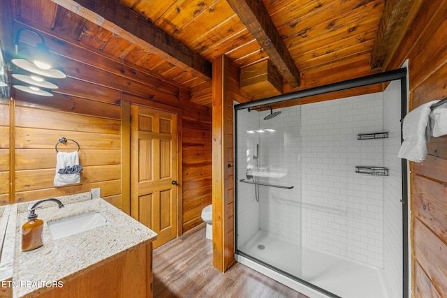 4372 Boogertown Rd Unit 2, Sevierville, TN 37876 - bathroom featuring a wood ceiling with exposed beams, a shower stall, vanity, wood finished floors, and wood walls