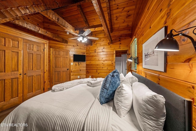 4372 Boogertown Rd Unit 2, Sevierville, TN 37876 - bedroom featuring wooden walls and a wood ceiling with exposed beams